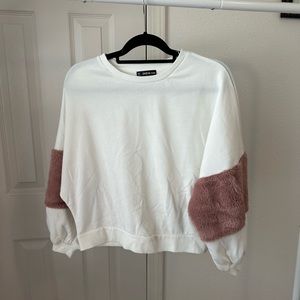 White crew neck with pink fur sleeves